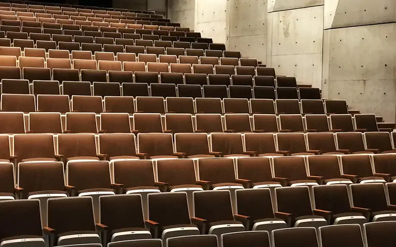 Rows of empty lecture theatre seats