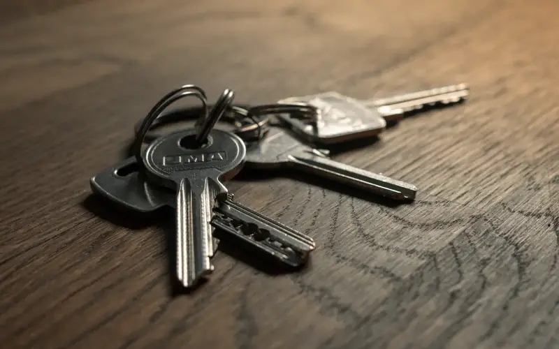 A ring of keys on a wooden table