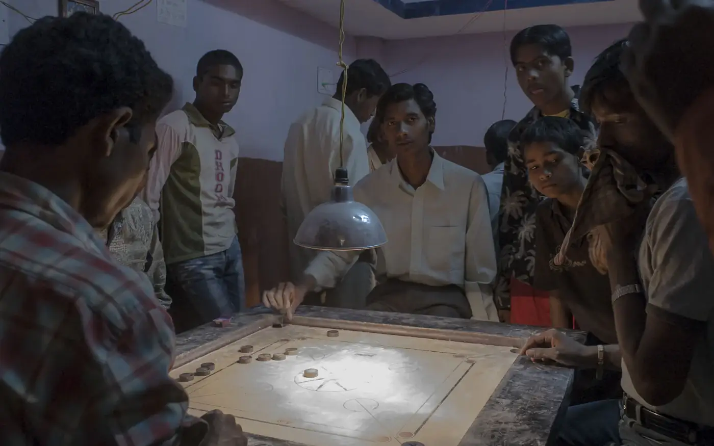 Colleagues gathered around a table, working through a problem together