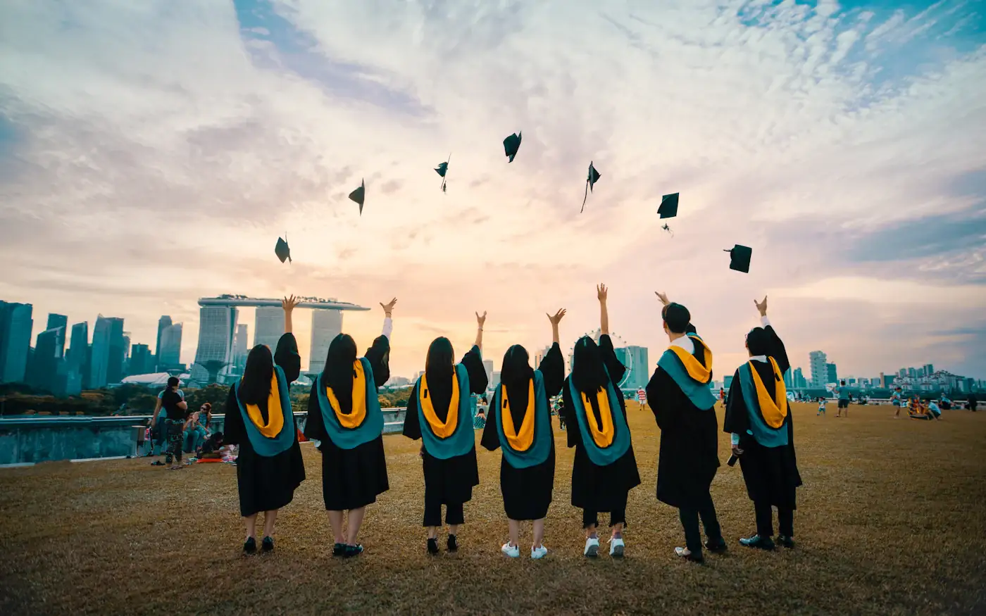 Graduates throwing their caps in the air