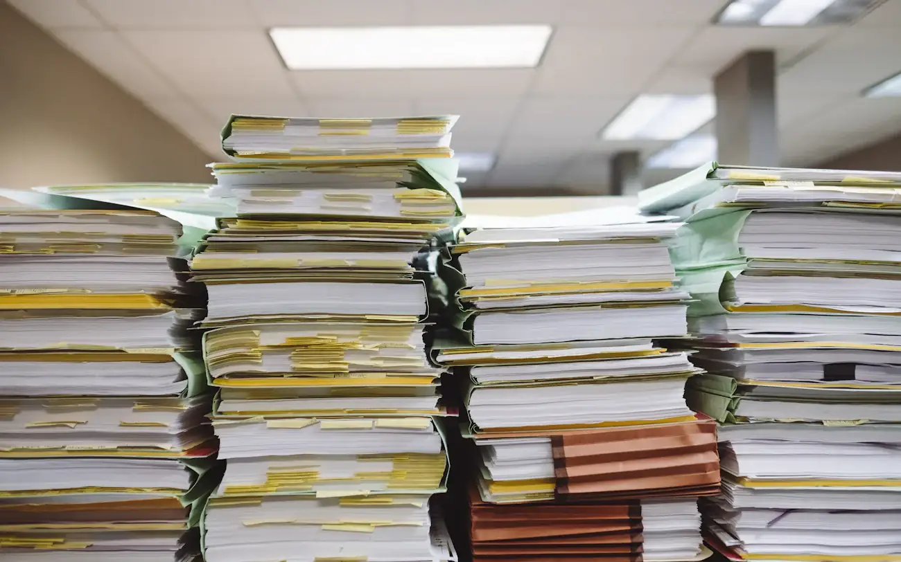 Stacks of paper files in an office