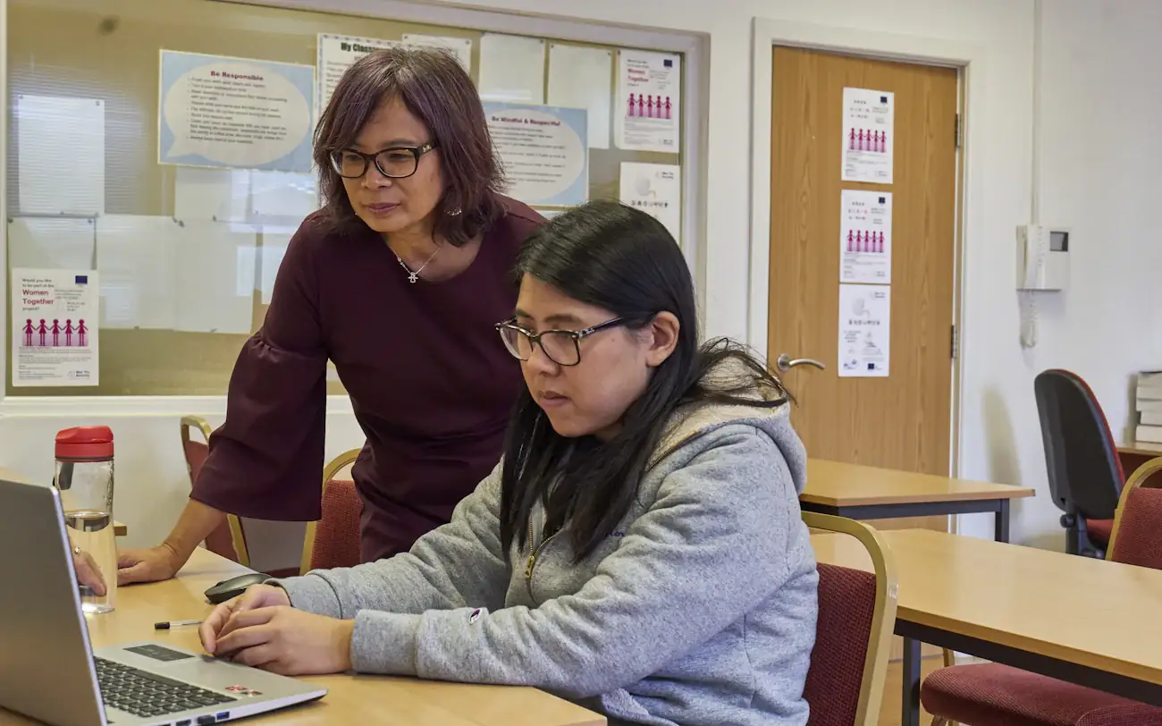 An advisor working through a screen with a student