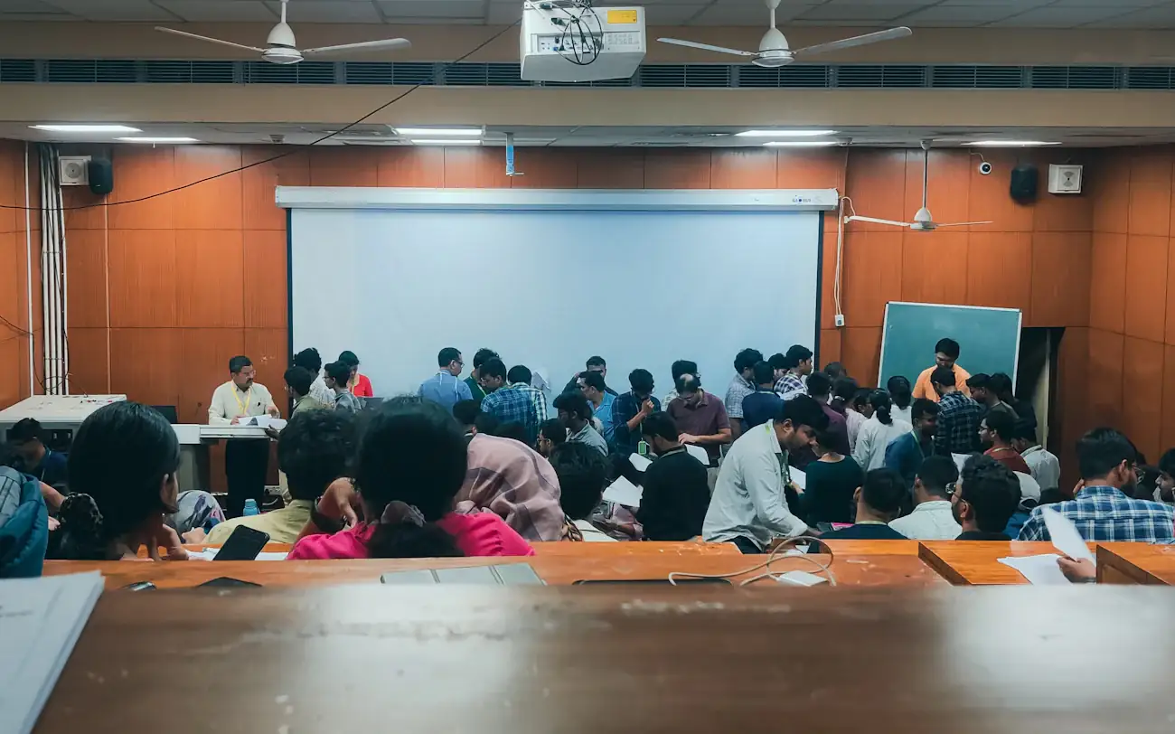 A full lecture hall seen from the back